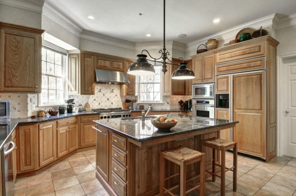 The kitchen at 17 Terry's Trail is warm and inviting. Photo credit: courtesy Brown Harris Stevens of the Hamptons.