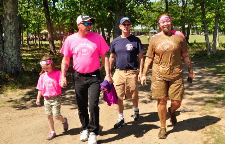 Hundreds of people filled Calverton's Enterprise Park to participate in the Long Island Adventure Race, a 5K filled with obstacles, some of which included mud.