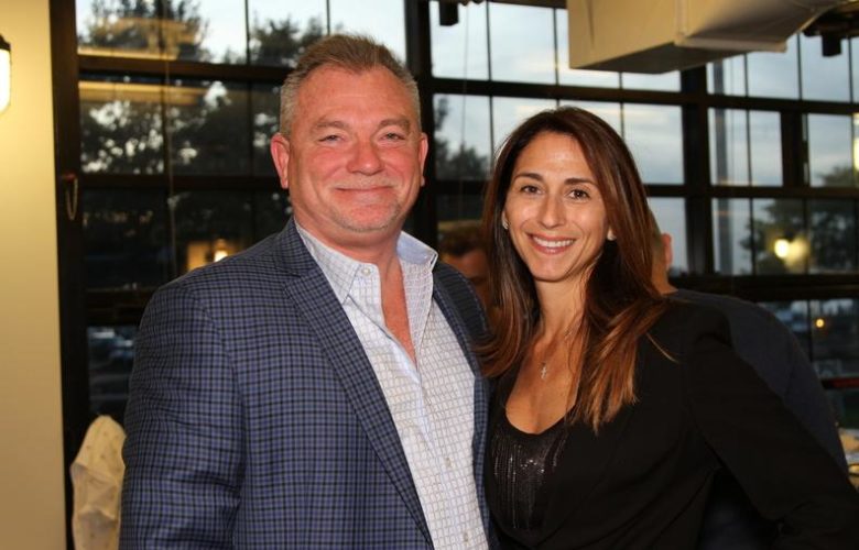 Bridgehampton National Bank President and CEO Kevin O'Connor and Director of Loan Operations VP Michelle McAteer in the BNB sponsored VIP lounge