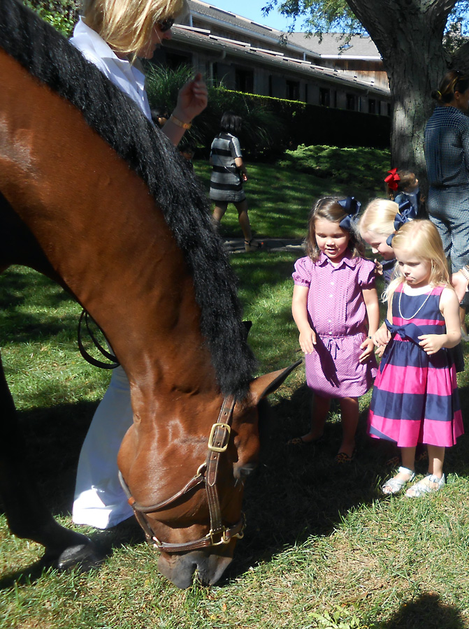 Zacardi, 16-year-old hunter/jumper, his owner, Shelli Breidenbach, Sasha Mollett, age 3, Scarlett Rueger, age 4, and Sloane Schwartz, age 3 attending the Ralph Lauren Presents Fall 2013 Girls Fashion Show at Wolffer Stables.
