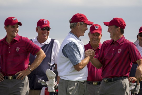 Former President George W. Bush shakes hands with Todd White on the 17th tee during a practice round with the USA Walker Cup team at the 2013 Walker Cup at National Golf Links of America in Southampton on Thursday. ©USGA/John Mummert