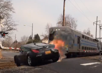 Train smashes into a car.