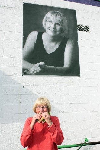 Mary Ann Tupper takes a bite out of the sandwich named for her created by Schmidt's. Photo credit: Tom Kochie