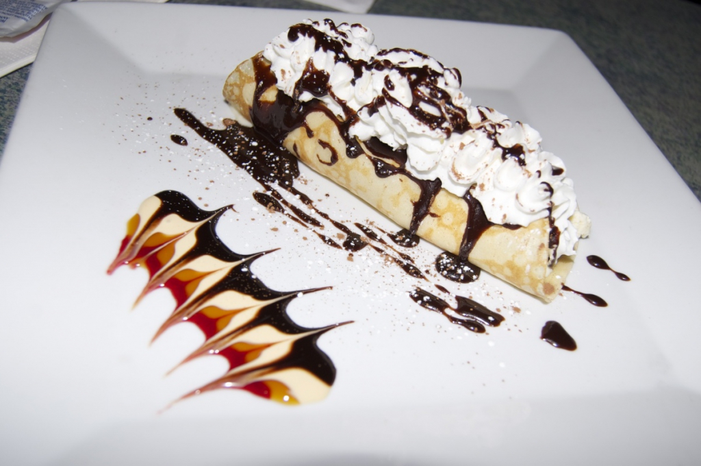 Ice cream and hot fudge crepe.