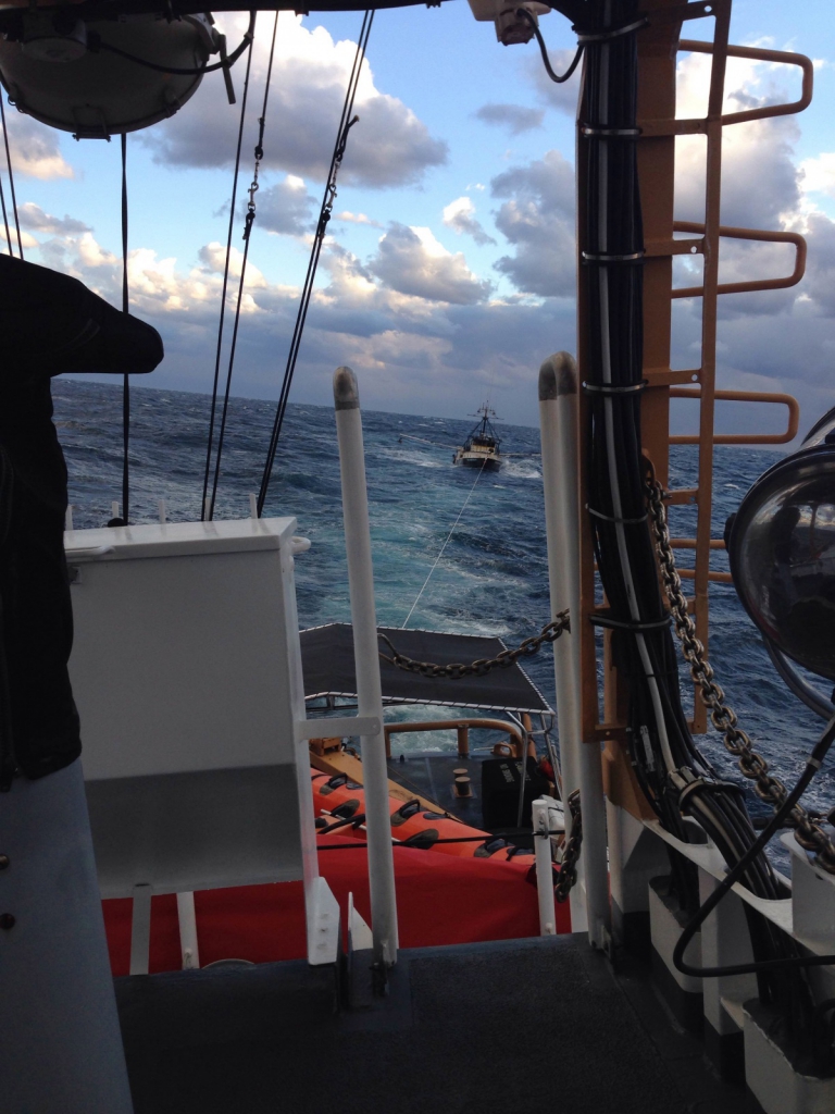 U.S. Coast Guard Cutter Sanibel looking back at the tow of the commercial fishing vessel Tradition. Photo credit: Lt. Michael Maas/Coast Guard