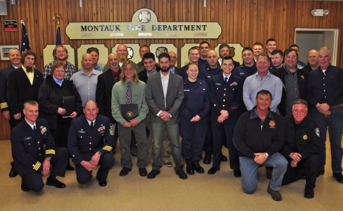 John Aldridge stands with members of the Coast Guard and good Samaritans who were awarded Friday evening.