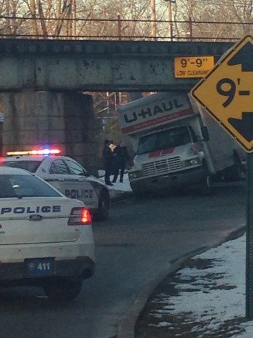 A U-Haul gets stuck under a bridge in East Hampton.
