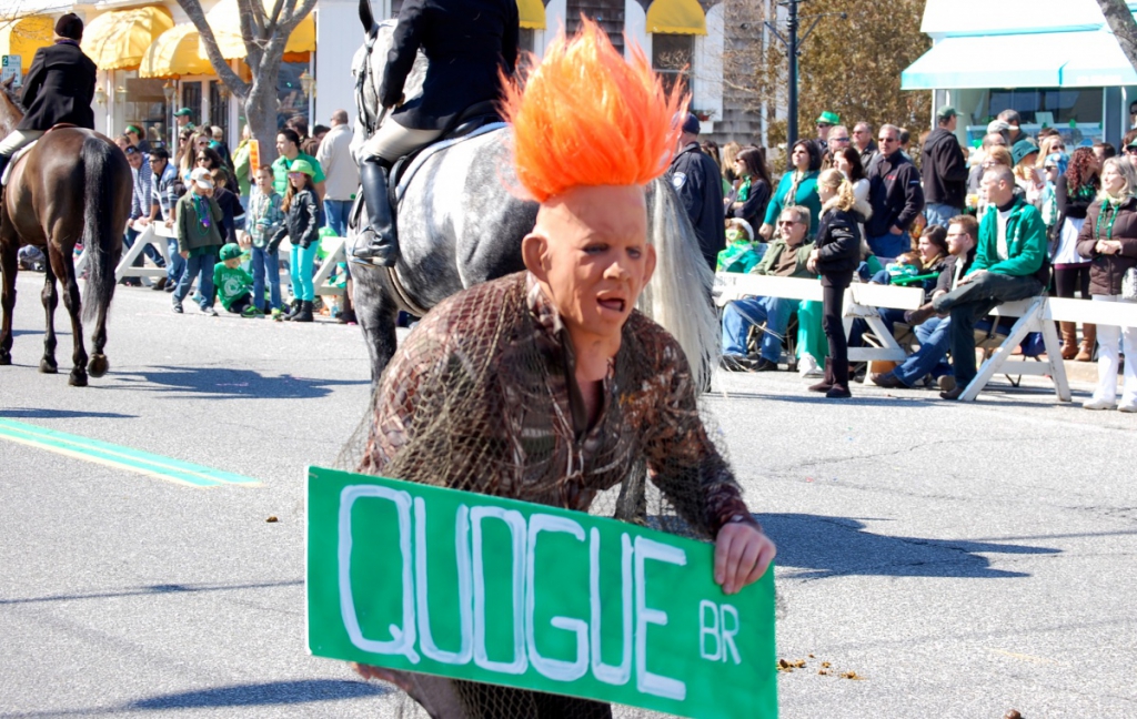 A skateboarding Conehead tries to redirect the parade to the Quogue Bridge.