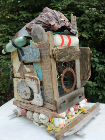 A birdhouse sculpture Carolyn Munaco created using marine debris.