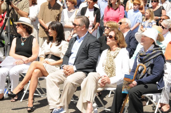 Hilaria Baldwin and Alec Baldwin sit among guests of honor.