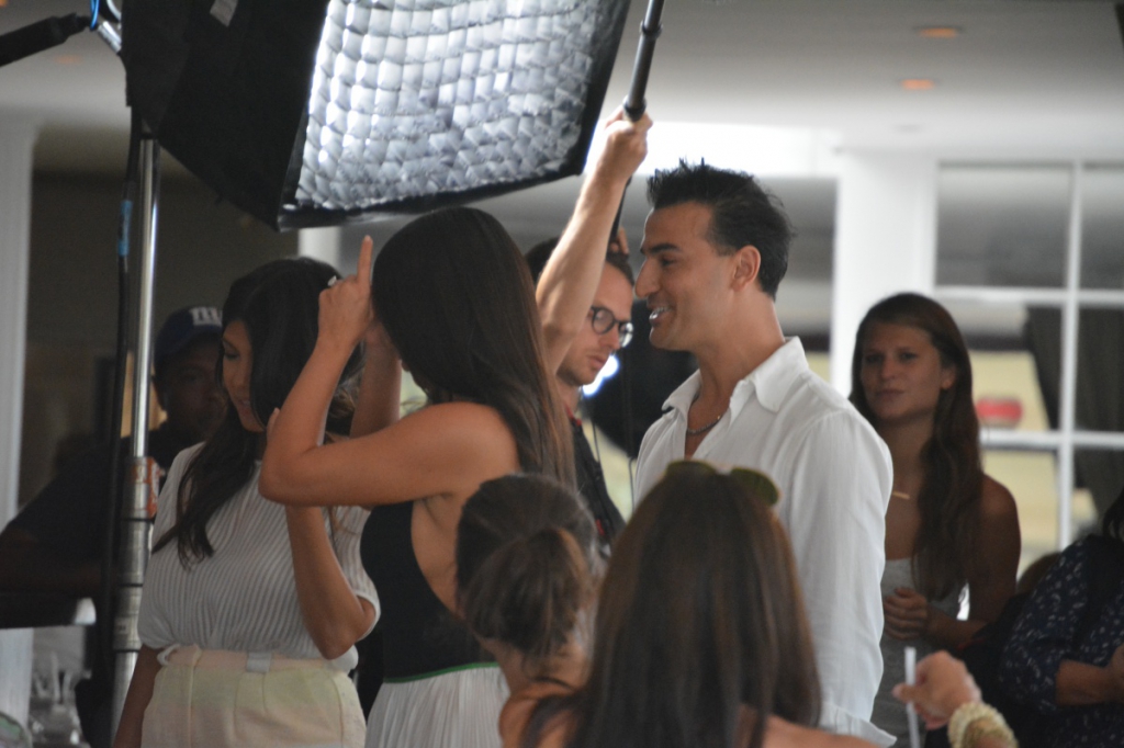 Kourtney and Kim Kardashian take a photo with 75 Main's Zach Erdem