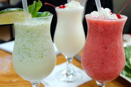 Frozen coconut mojito, frozen pina colada, and frozen strawberry daiquiri at The Driver's Seat Restaurant in Southampton Village