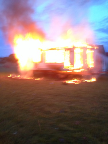 Flames engulf an unoccupied residence on the Shinnecock Indian Reservation. Photo credit: Courtesy Southampton Fire Department