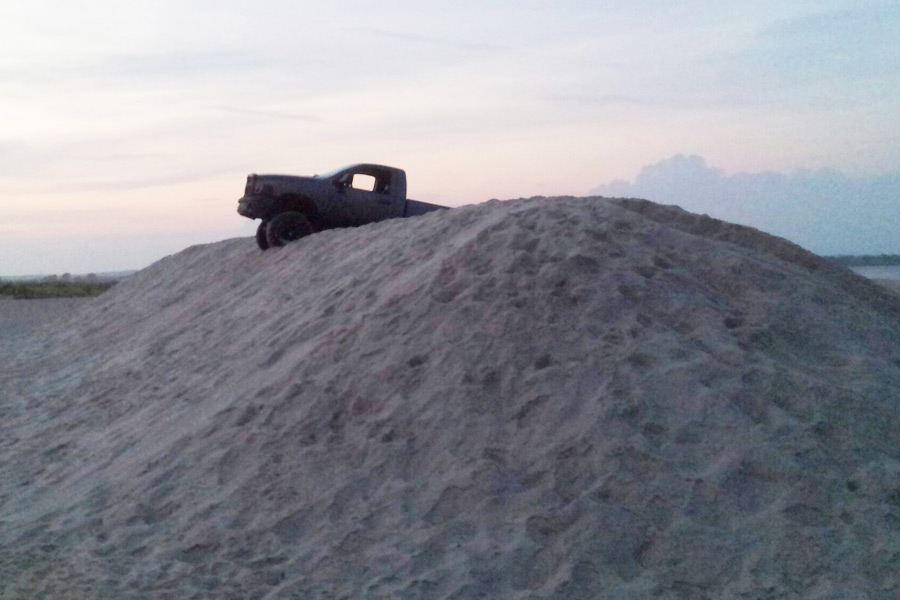 Truck stuck in sand near Flying Point Beach in Water Mill