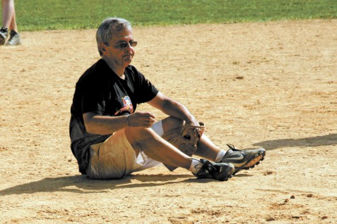 Mike Lupica recovers from a diving catch at the 2013 Artists and Writers Game