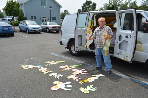 Michael R. Zotos dropped by the Dan's Papers office August 1 with some of his artwork, which he posted around the Hamptons all summer.