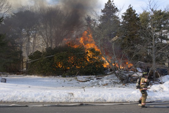 Water Mill house burns following an explosion.