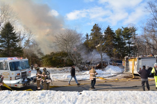 Gray smoke rose from the rubble after firehouses sprayed down the flames. Photo credit: Brendan J. O'Reilly