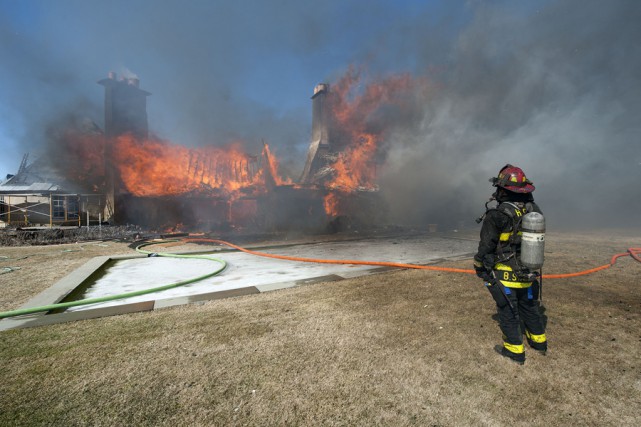 At 2:35 p.m. on Wednesday, March 18th, 2015, members of the East Hampton Fire Department responded to the Morton residence for a report of a structure fire. First arriving units found the structure, which was under renovation at the time, heavily involved with fire. Mutal aid was called from the Montauk, Amagansett, Springs, Sag Harbor, Bridgehampton, Southampton and Hampton Bays Fire Departments, and the North Sea Fire Department was called to stand by at the EHFD headquarters. Cold temperatures, a strong wind and water supply challenges made fighting the fire difficult, and eventually heavy equipment was called for to knock the chimneys over and remove debrisi so that all remaining pockets of fire could be extinguished. I was not until well after that 9:00 p.m. that evening that all units were fully back in service. It was suspected that roofers installing new flashing were to blame for the fire, but the East Hampton Village Fire Marshal's office responded and was on scene to determine the fire's cause and origin.