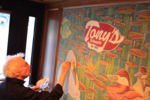 Dan's Papers cover artist Joe Chierchio draws his Spring mural at Tony's Di Napoli in NYC