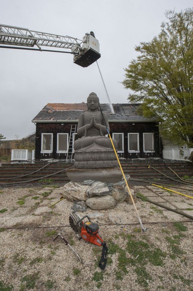 Members of the Southampton, North Sea, Hampton Bays, Bridgehampton, Sag Harbor and East Hampton Fire Departments fight a fire in a vacant building at 337 Montauk Highway in Water Mill, NY on Saturday, May 9th, 2015