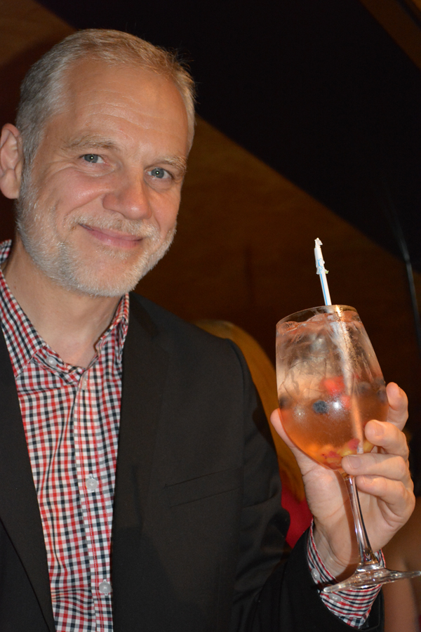 Roman Roth holding a “Free Spirit” non-alcoholic cocktail