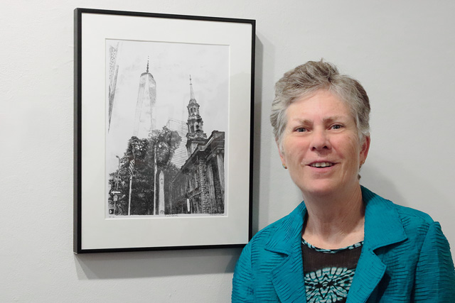 Brenda Berkman standing next to her Tower behind NYC building print