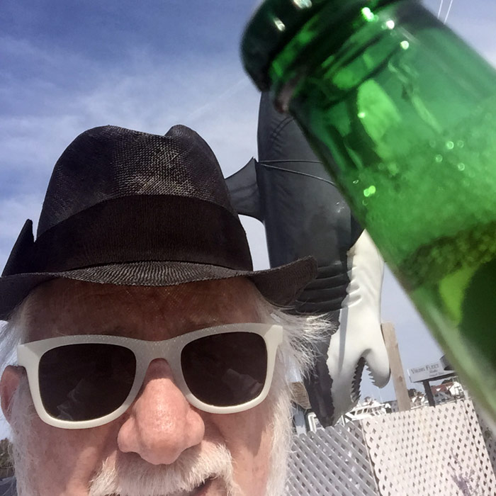 Dan Rattiner selfie in front of the Montauk Fishing Village Shark