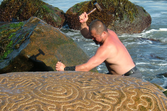 Artist Ken Hiratsuka carving the mysterious Montauk rock in 2004