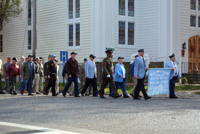 Veterans march down Jobs Lane during the 2014 Southampton Village Veterans Day Parade.