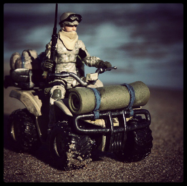 Date/location unknown: US Navy Seal sniper maneuvers along the coast
