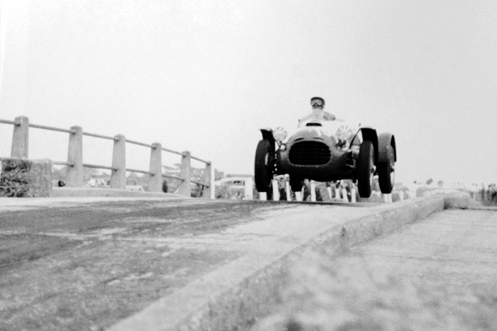 Briggs Cunningham is airborne on the Sag Pond Bridge in a Ferrari in 1953