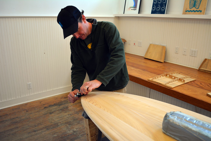 Brian Schopfer shapes a board at Grain Surfboards in Amagansett