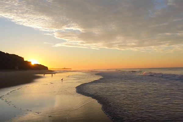 Jamie Bugess video still of Montauk beach at sunrise