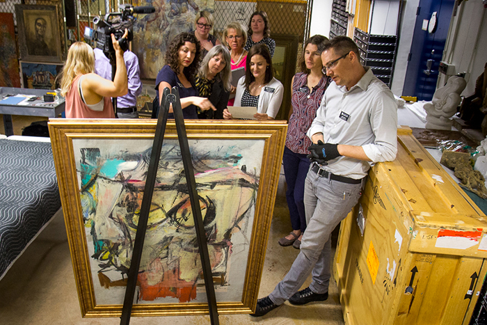 Checking the verso of "Woman-Ochre"