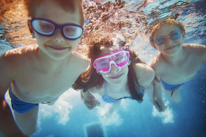Kids swimming underwater