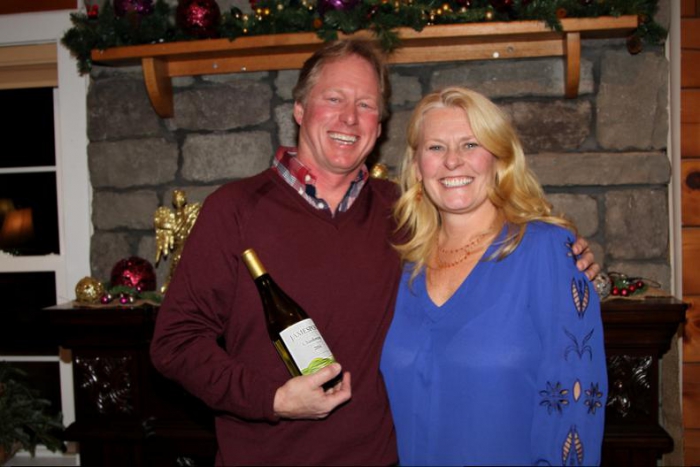 Ron Goerler and wife Joanne of Jamesport Vineyards holding a selection of wine from his vineyard