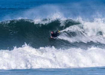 79806810 – bodyboarder in action on the ocean waves on a sunny day.