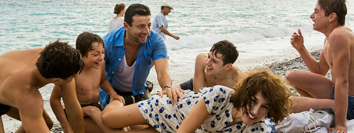 Briefly, the family is happily reunited on the beach in Nice