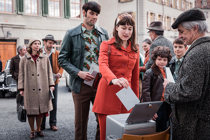 Nora (Marie Leuenberg ) and Hans (Maximilian Simonisch) cast their ballots in "The Divine Order"