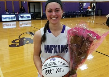 Hampton Bays High School basketball star MacKenzie Tyler celebrates her 1,000th point