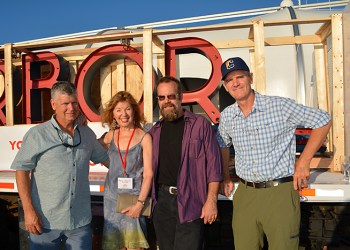 Chris Denon, April Gornik, Clayton Orehek and John Battle with the neon sign