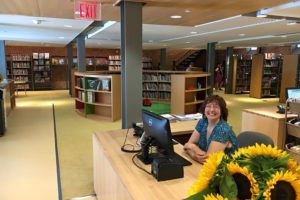 Sue Farrell inside the new John Jermain Memorial Library