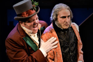 Bobby Montaniz as Christmas Present with Jeffery Sanzel as Scrooge in "A Christmas Carol" at Theatre Three