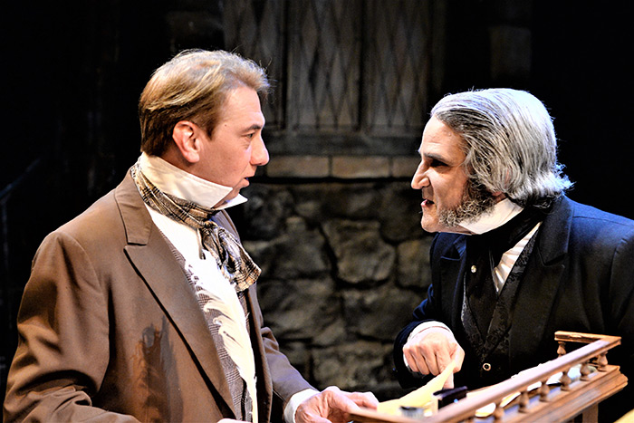 Douglas J. Quattrock as Bob Cratchit with Jeffery Sanzel as Scrooge in "A Christmas Carol,"