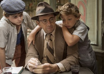 Two boys cuddle with father: The kindly Roman is the inspirtation for Jojo (R) and Maurice