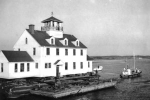 Towing the Coast Guard station, March, 1955