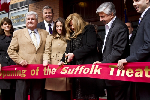 Theater owners Diane and Bob Castaldi cut the ribbon to the Suffolk Theater in downtown Riverhead