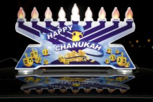 A lighted menorah atop one of the cars in the MenorahCade