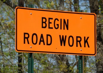 Begin road work ahead sign